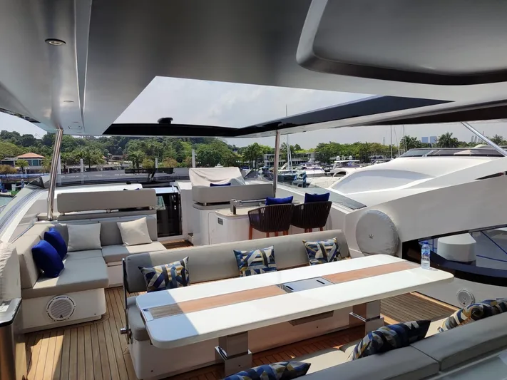  Yacht Photos Pics Luxurious 2017 Dominator Ilumen 28 yacht deck with elegant seating and scenic marina view.