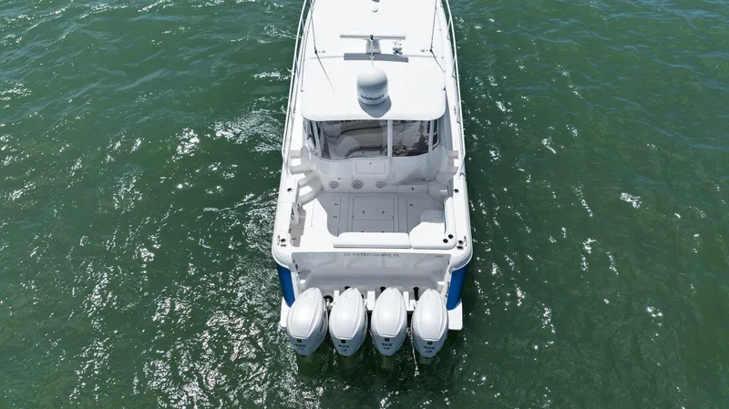Damn Lucky Yacht Photos Pics Aerial view of 2019 Intrepid 475 boat with four engines on the water.