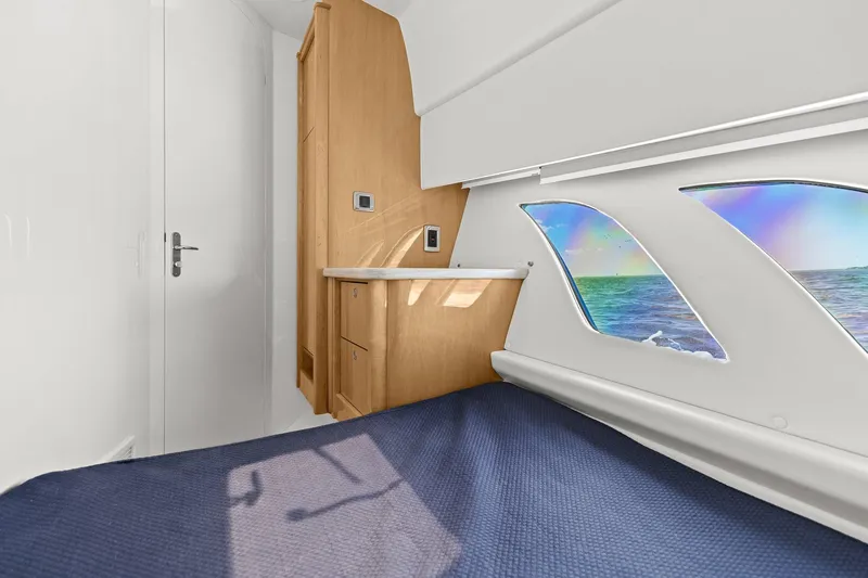 Damn Lucky Yacht Photos Pics Cabin interior of 2019 Intrepid 475 yacht with ocean view windows.