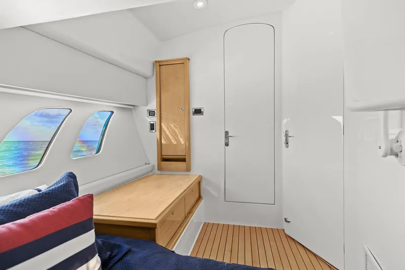 Damn Lucky Yacht Photos Pics Luxurious interior of 2019 Intrepid 475 yacht with modern design and ocean view windows.