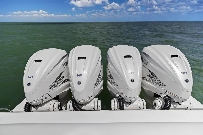 Damn Lucky Yacht Photos Pics Four Yamaha V8 outboard engines on a 2019 Intrepid 475 boat, ocean backdrop.