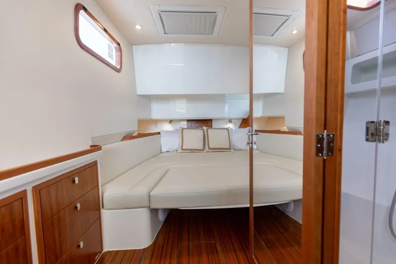 New Mjm 4 Yacht Photos Pics Luxurious cabin interior of 2025 MJM 4 yacht with elegant wood finishes.
