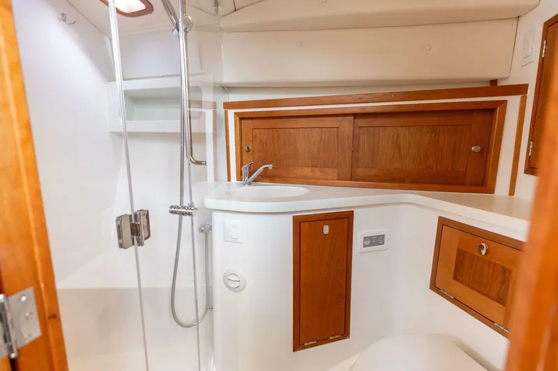 New Mjm 4 Yacht Photos Pics Modern MJM 4 yacht bathroom with wooden cabinets and sleek shower, 2025 model.