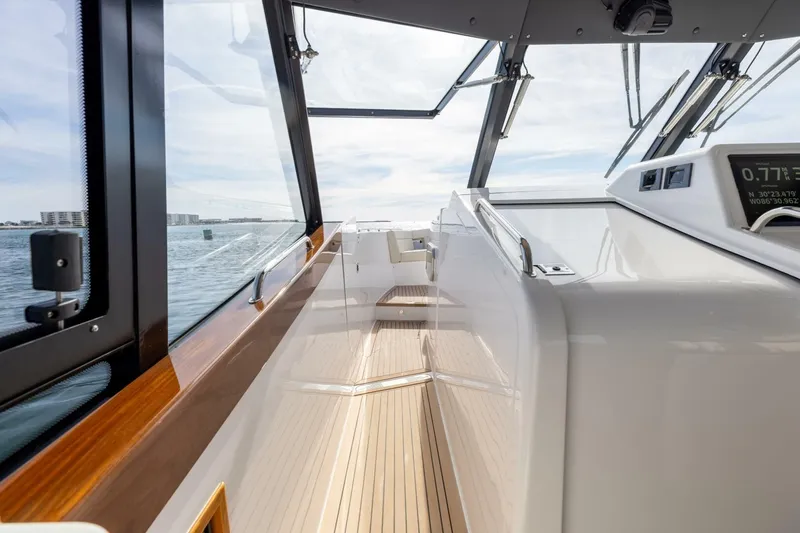New Mjm 4 Yacht Photos Pics 2025 MJM 4 yacht interior with sleek design and wooden accents on open water.