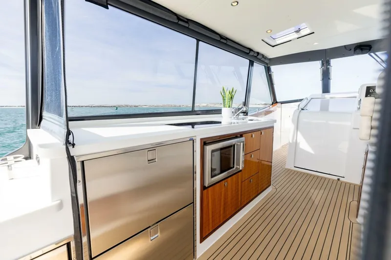 New Mjm 4 Yacht Photos Pics Luxurious 2025 MJM 4 yacht interior with modern kitchen and ocean view.