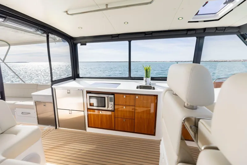 New Mjm 4 Yacht Photos Pics Luxurious interior of 2025 MJM 4 yacht with modern kitchen and ocean view.