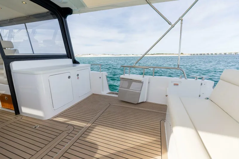 New Mjm 4 Yacht Photos Pics 2025 MJM 4 yacht deck with seating, ocean view, and sleek design.