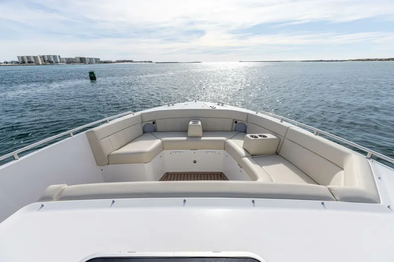 New Mjm 4 Yacht Photos Pics Luxurious seating on 2025 MJM 4 boat, cruising on serene waters under a clear sky.