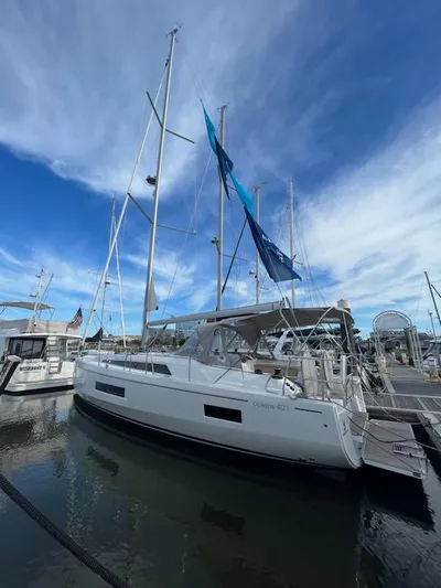 Lena S. Yacht Photos Pics 2023 Beneteau Oceanis 40.1 sailboat docked under a vibrant blue sky.