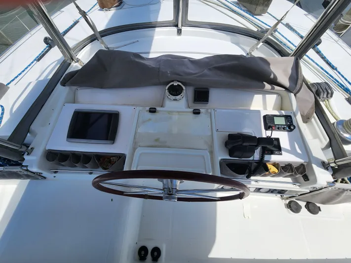 Orion Yacht Photos Pics Helm station of 2006 Lagoon 440 catamaran with navigation equipment and steering wheel.