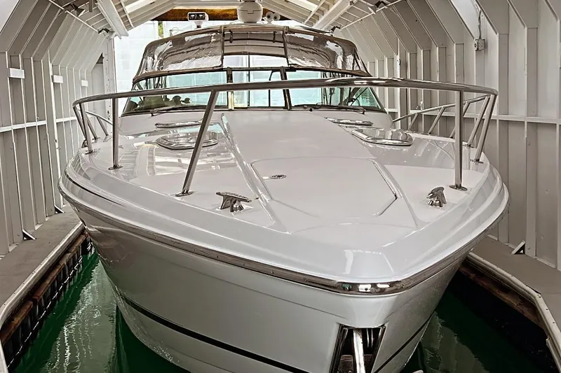  Yacht Photos Pics 2011 Formula 400 Super Sport boat docked in a covered marina.