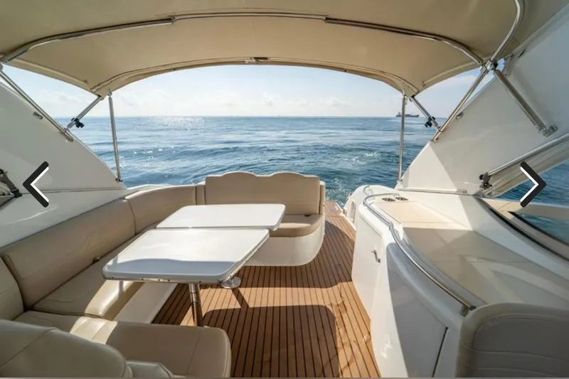  Yacht Photos Pics 2011 Formula 400 Super Sport yacht interior with ocean view, featuring elegant seating and table.