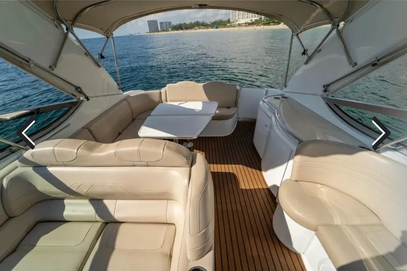  Yacht Photos Pics Luxurious 2011 Formula 400 Super Sport yacht interior with beige seating and ocean view.