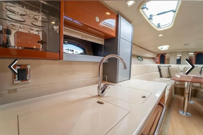  Yacht Photos Pics Luxurious interior of 2011 Formula 400 Super Sport yacht with modern kitchen and seating area.