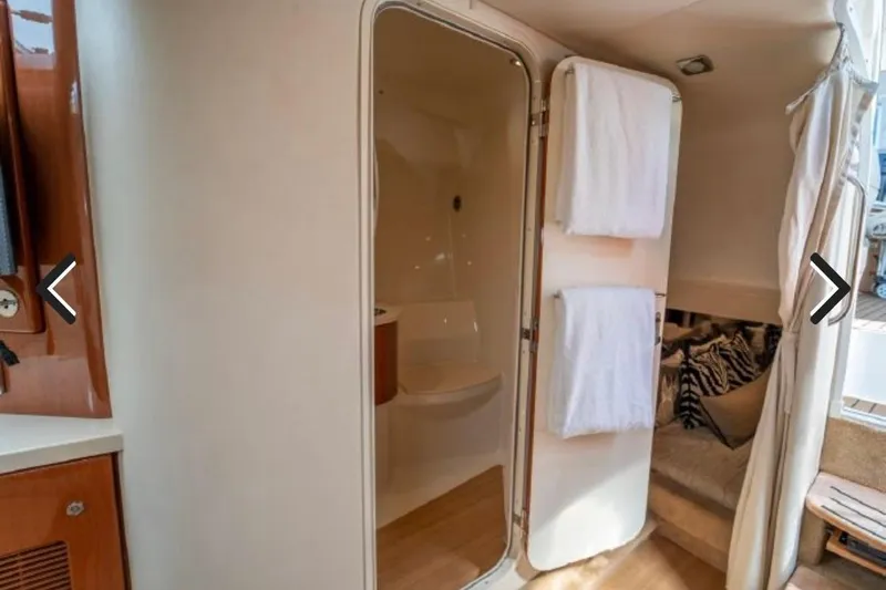  Yacht Photos Pics Interior of 2011 Formula 400 Super Sport yacht, featuring a bathroom and cozy seating area.