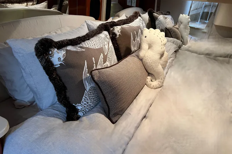  Yacht Photos Pics Luxurious bedding with decorative pillows and plush seahorse on a Formula 400 Super Sport yacht.