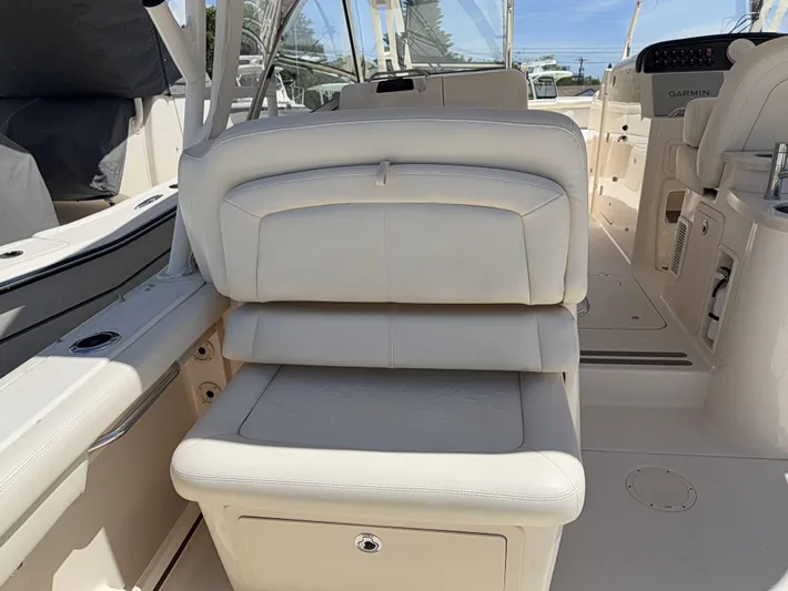 335-714 Used Yacht Photos Pics 2021 Grady-White Freedom 335 boat interior with beige seating and console.