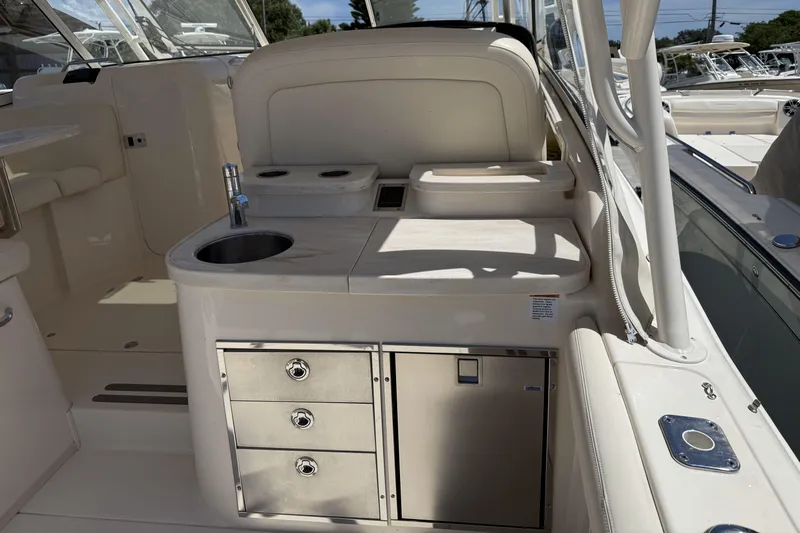 335-714 Used Yacht Photos Pics 2021 Grady-White Freedom 335 boat interior with sink and storage drawers.