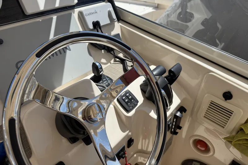 335-714 Used Yacht Photos Pics Steering wheel and controls of 2021 Grady-White Freedom 335 boat cockpit.