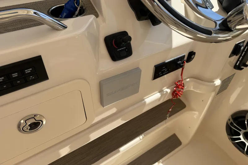 335-714 Used Yacht Photos Pics Control panel of 2021 Grady-White Freedom 335 boat with steering wheel and Seakeeper system.