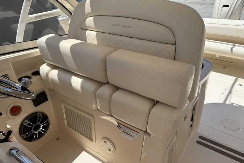 335-714 Used Yacht Photos Pics 2021 Grady-White Freedom 335 boat interior with beige seating and steering wheel.