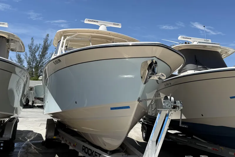 335-714 Used Yacht Photos Pics 2021 Grady-White Freedom 335 boat on trailer under clear blue sky.
