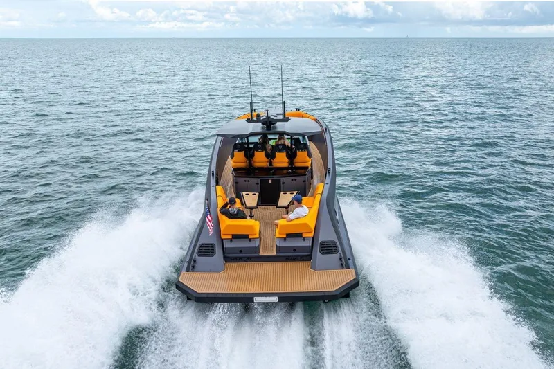  Yacht Photos Pics 2024 Lekker 44 boat cruising on open water with vibrant seating.