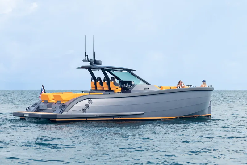  Yacht Photos Pics 2024 Lekker 44 luxury yacht cruising on open water with sleek design and vibrant seating.