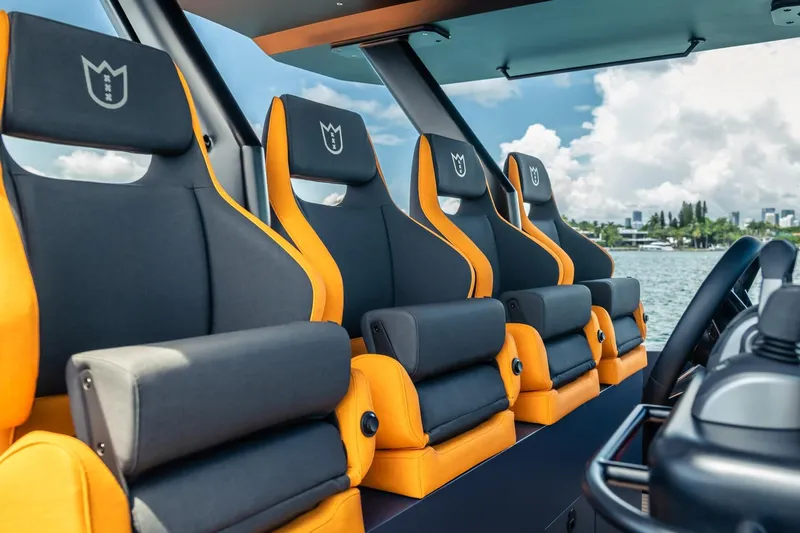  Yacht Photos Pics Luxurious seating on 2024 Lekker 44 boat, featuring sleek design and vibrant colors.
