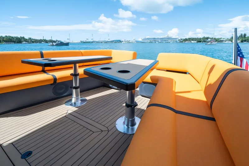  Yacht Photos Pics Luxurious 2024 Lekker 44 yacht with orange seating and scenic ocean view.