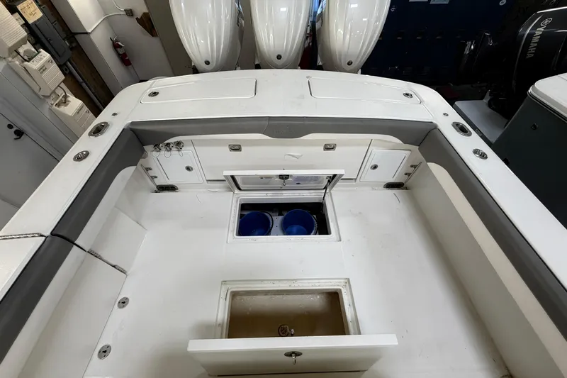 White Yacht Photos Pics 2024 Regulator 34 boat interior with storage compartments and seating.