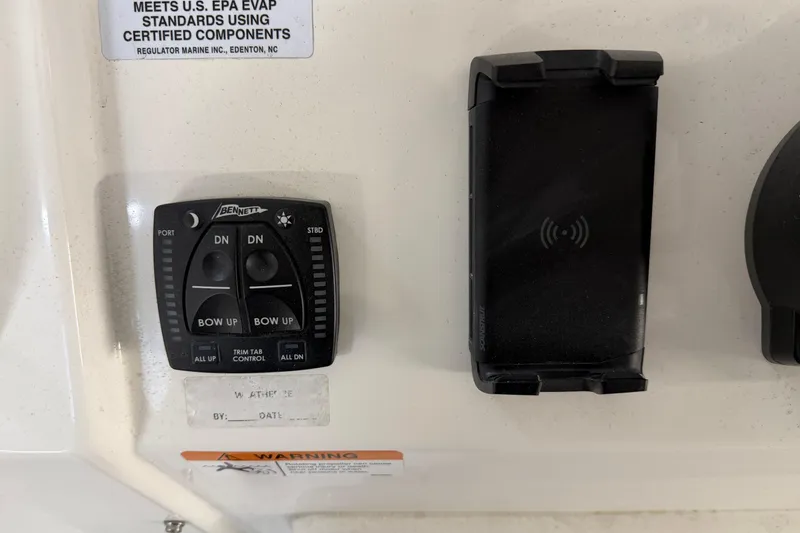 White Yacht Photos Pics 2024 Regulator 34 boat control panel with Bennett trim tab and phone holder.