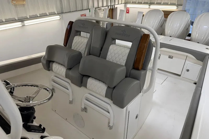 White Yacht Photos Pics 2024 Regulator 34 boat interior with luxurious seating and steering wheel.