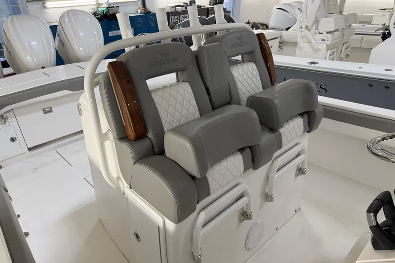 White Yacht Photos Pics 2024 Regulator 34 boat interior with luxurious gray and white seating.