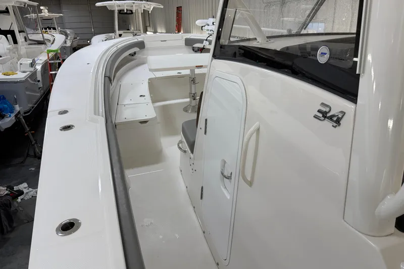 White Yacht Photos Pics 2024 Regulator 34 boat interior with sleek white design and modern features.