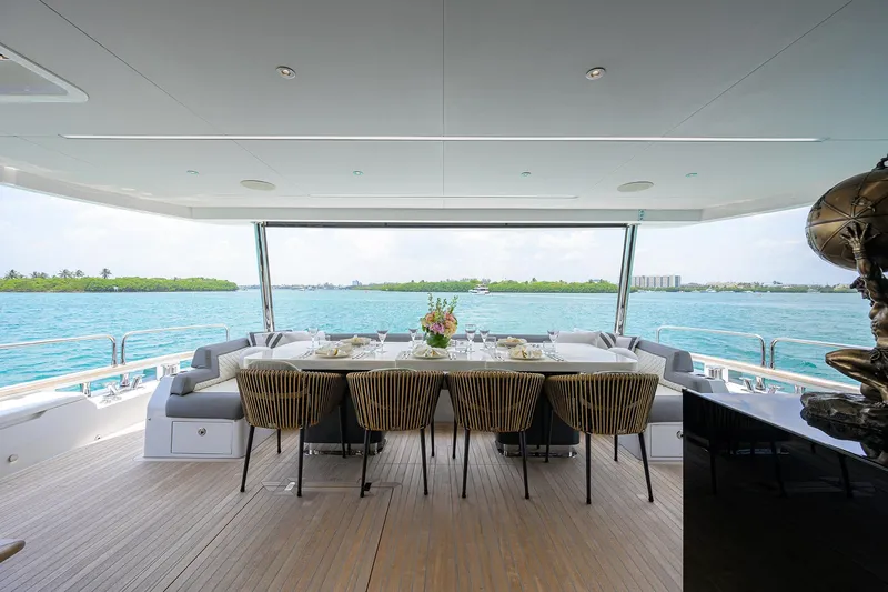  Yacht Photos Pics Luxurious dining area on 2024 Sirena 88 yacht with ocean view.