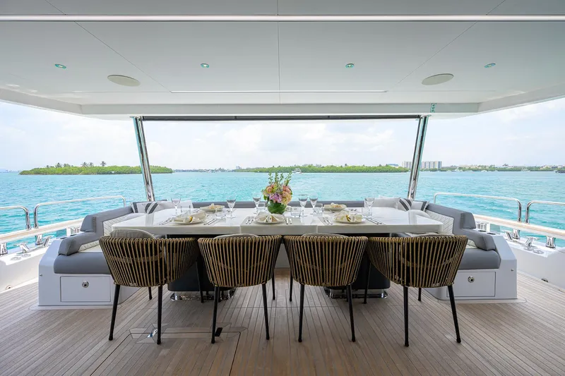  Yacht Photos Pics Luxury dining area on 2024 Sirena 88 yacht with ocean view.