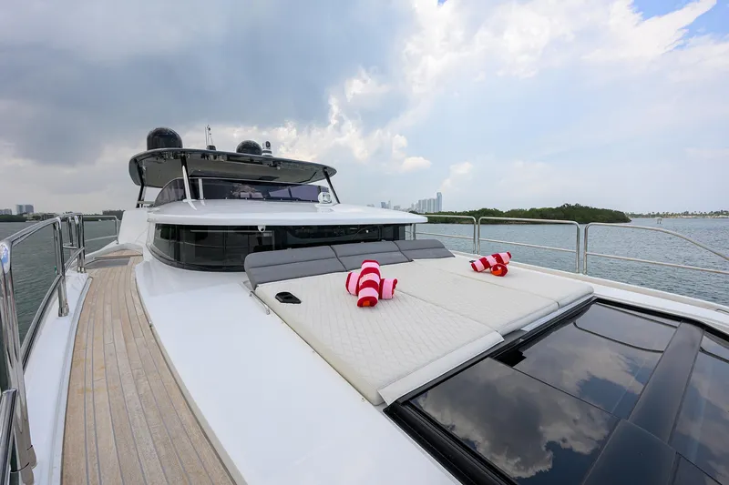  Yacht Photos Pics 2024 Sirena 88 yacht with sunbathing deck and scenic ocean view.