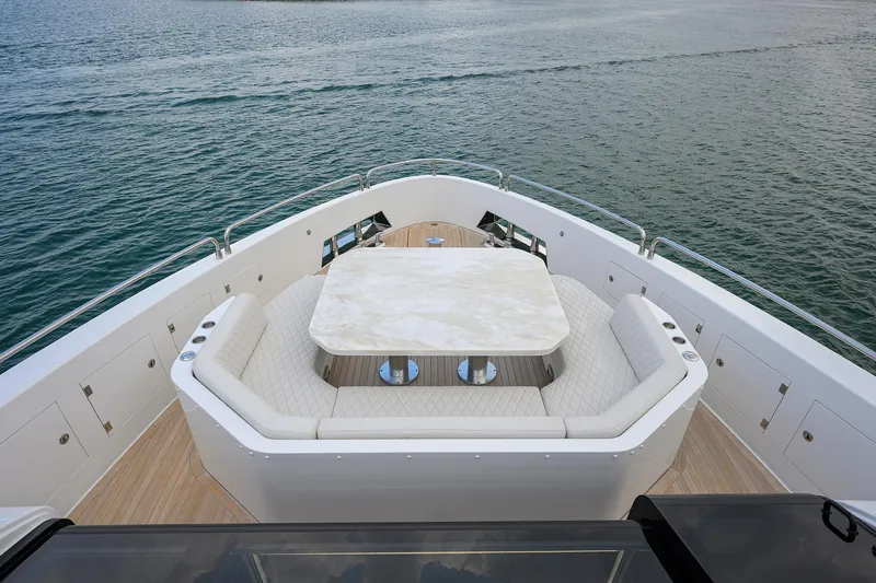  Yacht Photos Pics Luxury seating area on 2024 Sirena 88 yacht, featuring elegant design and ocean view.