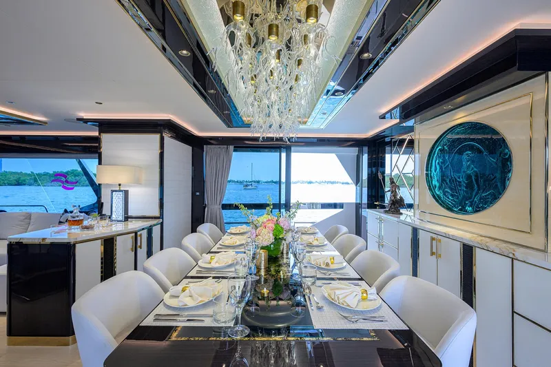  Yacht Photos Pics Luxurious dining area on 2024 Sirena 88 yacht with elegant decor and sea view.