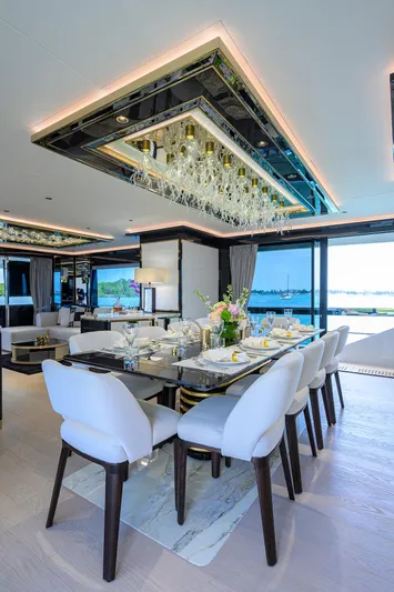  Yacht Photos Pics Luxurious interior of 2024 Sirena 88 yacht with elegant dining area and modern decor.