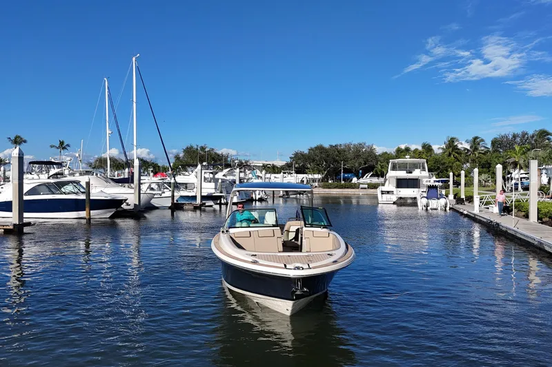  Yacht Photos Pics 2026 Chris-Craft Launch 35 GT boat in a marina with clear blue sky.
