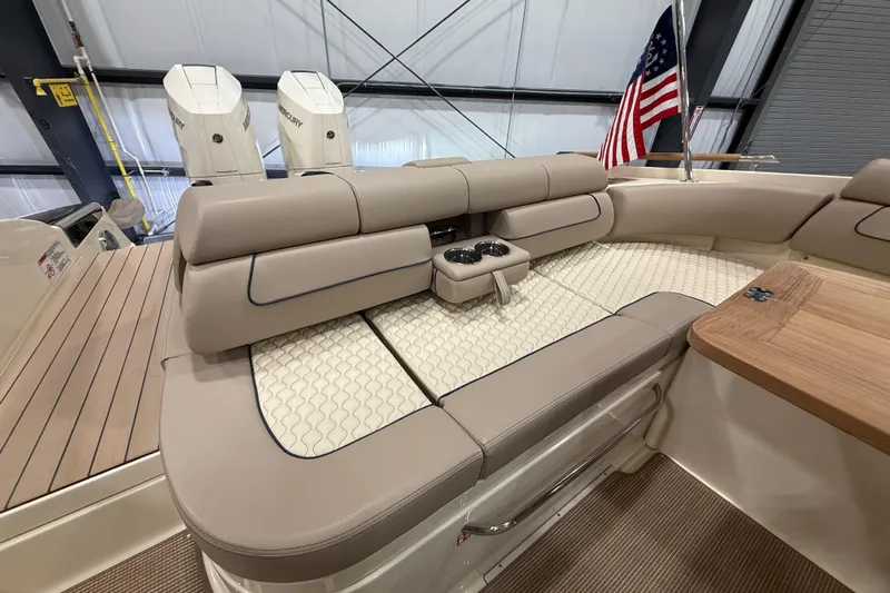  Yacht Photos Pics 2026 Chris-Craft Launch 35 GT interior with beige seating and American flag.