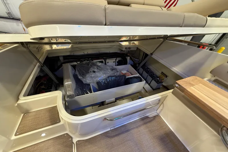  Yacht Photos Pics 2026 Chris-Craft Launch 35 GT interior storage compartment with open seating and organized equipment.