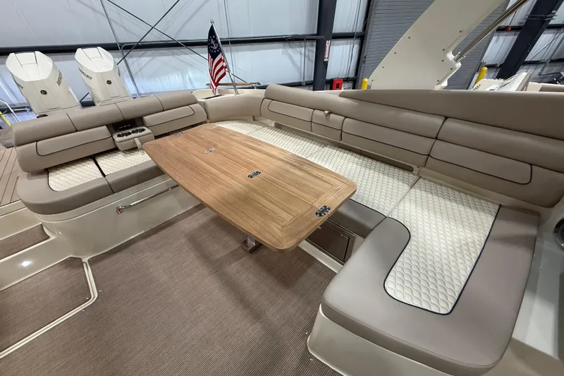  Yacht Photos Pics Luxurious interior of 2026 Chris-Craft Launch 35 GT with elegant seating and wooden table.