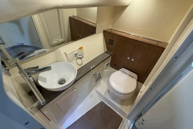  Yacht Photos Pics Luxurious bathroom in 2026 Chris-Craft Launch 35 GT boat, featuring modern sink and toilet.