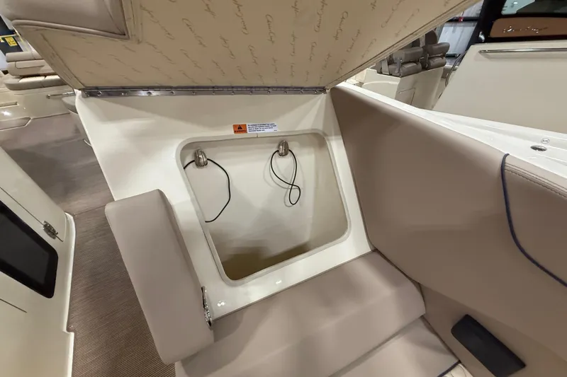  Yacht Photos Pics 2026 Chris-Craft Launch 35 GT interior storage compartment with beige seating and upholstery.