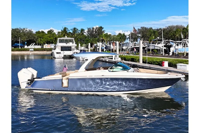  Yacht Photos Pics 2026 Chris-Craft Launch 35 GT boat docked in a marina under a clear blue sky.