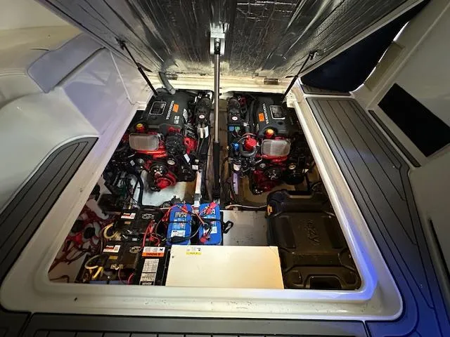  Yacht Photos Pics Engine compartment of 2005 Cruisers Yachts 340 Express, showcasing dual engines and battery setup.