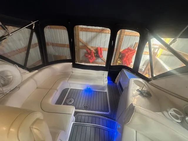  Yacht Photos Pics 2005 Cruisers Yachts 340 Express interior with white seating and blue LED lighting.